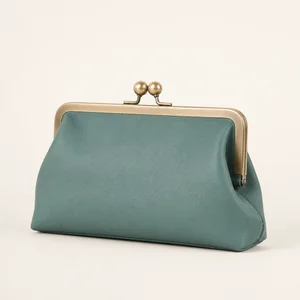 Frame bag with metal clasp and structured opening